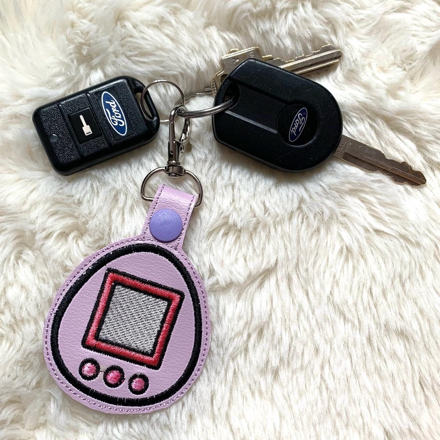 Purple Tamagotchi Pet Game 90s Keychain