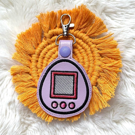 Purple Tamagotchi Pet Game 90s Keychain